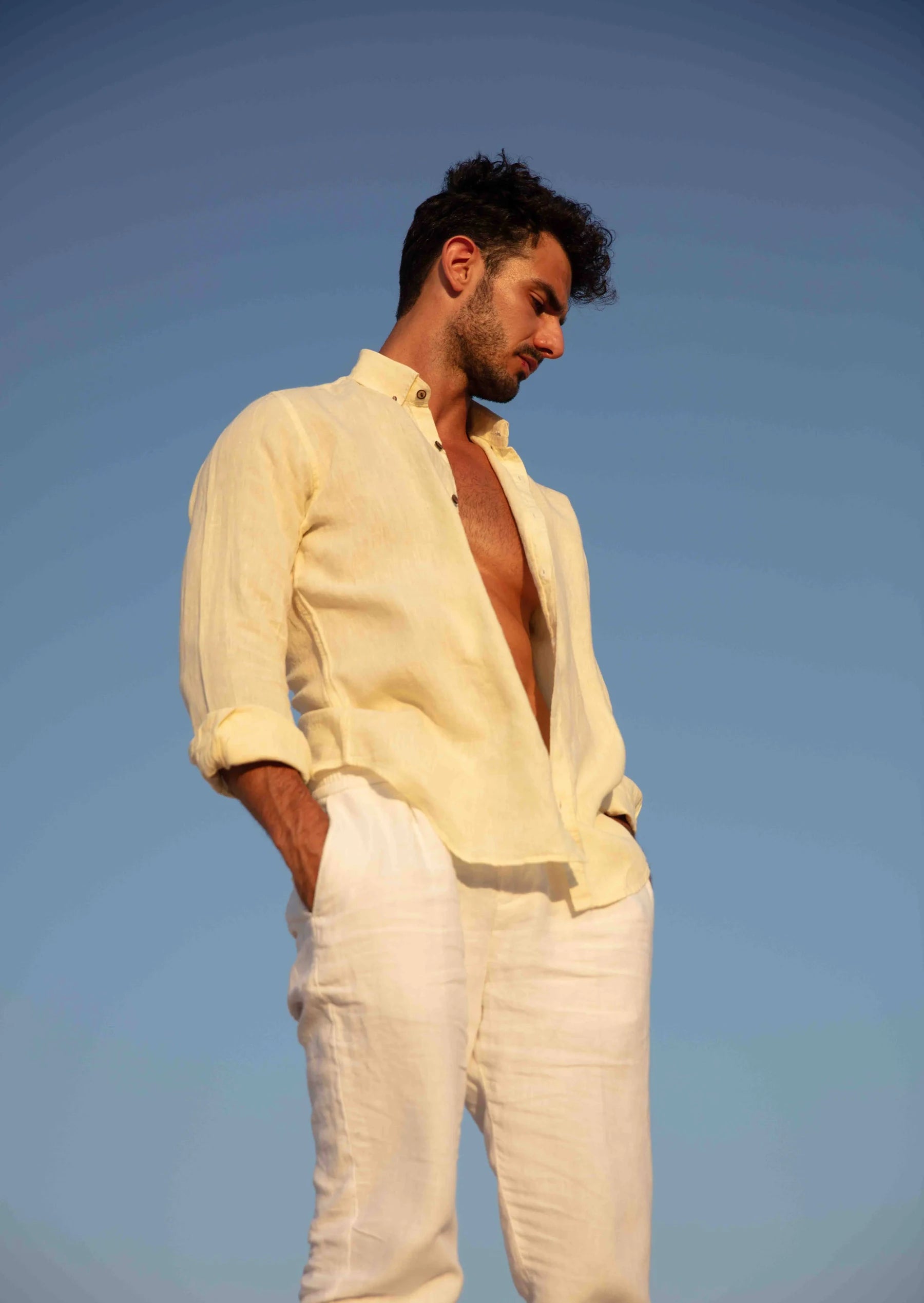 Man wearing a butter yellow linen shirt